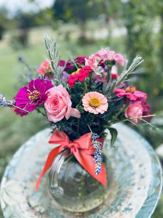 Summer bouquet with a coral ribbon