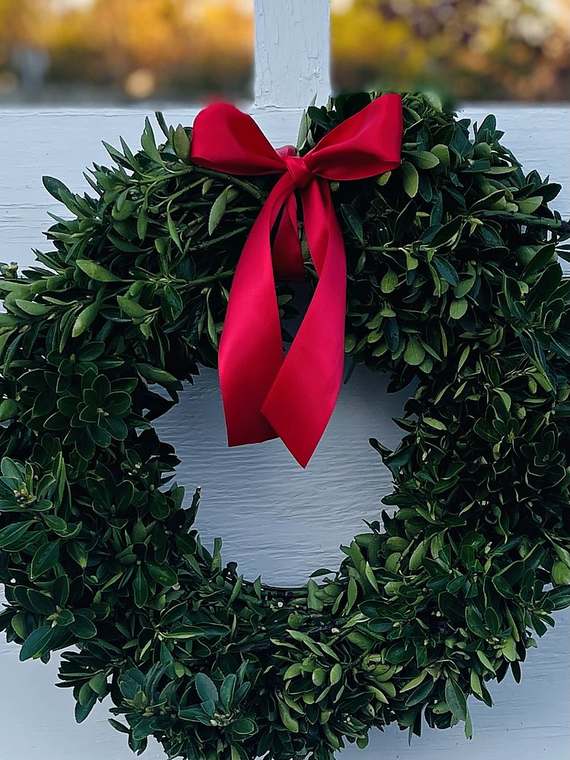 Boxwood wreath with a red bow
