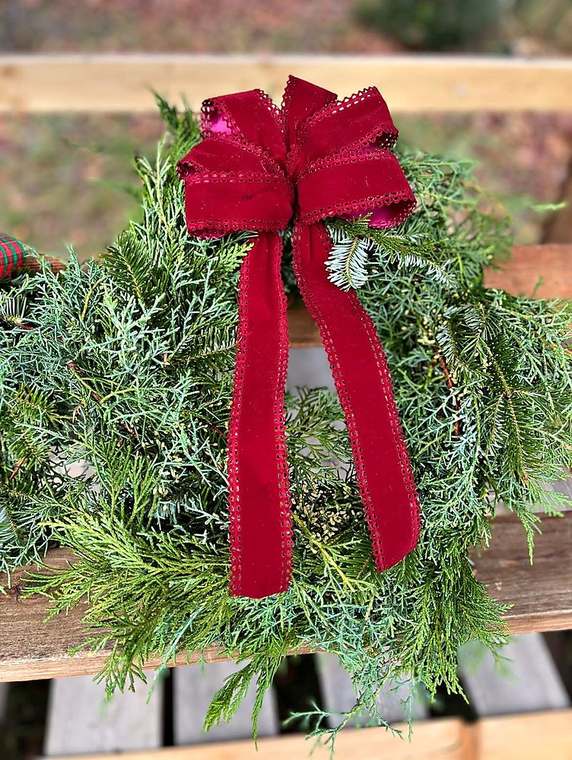 Cedar & fir wreath with a burgundy velvet bow
