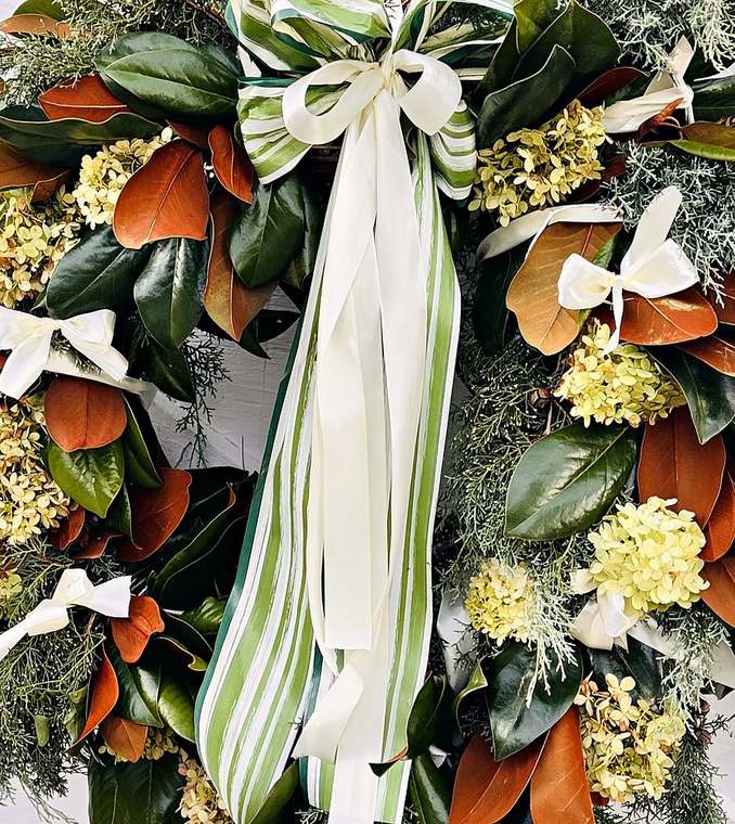Magnolia and green hydrangea wreath with a green and ivory striped bow