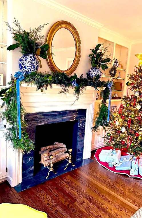 Fresh cedar and magnolia garland draped across a mantel