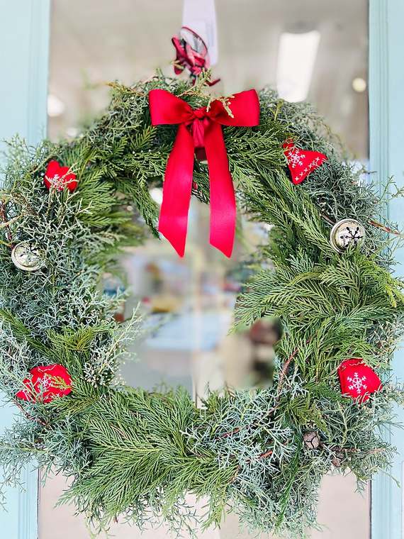 Cedar wreath with a red bow, jingle bells & felt hearts