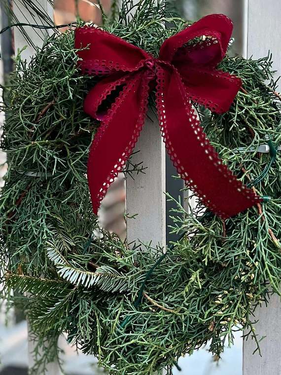 Juniper wreath with a red velvet bow