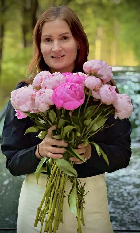 A big bouquet of fresh pink garden peonies